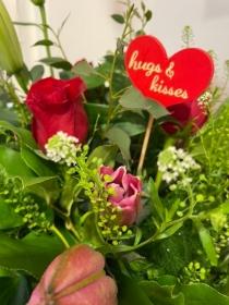 Pink Lily and Red Rose hand tied bouquet